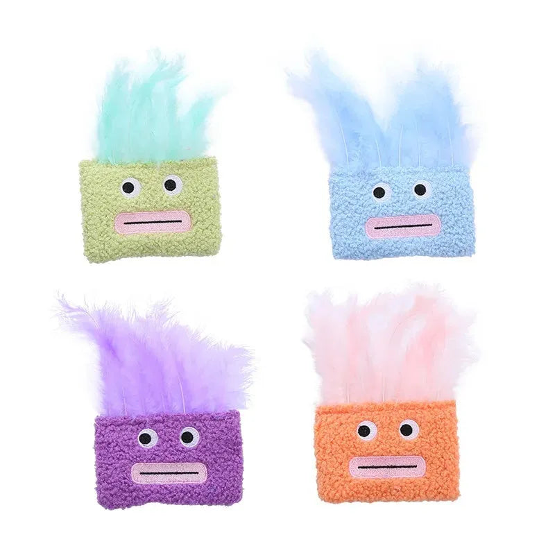 Cat plush toy with big mouth explosion head shape in blue, green, orange, and purple colours