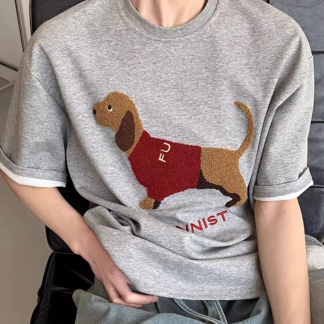 Men's grey cotton T-shirt with embroidered sausage dog design on the chest, short sleeves and round neck.