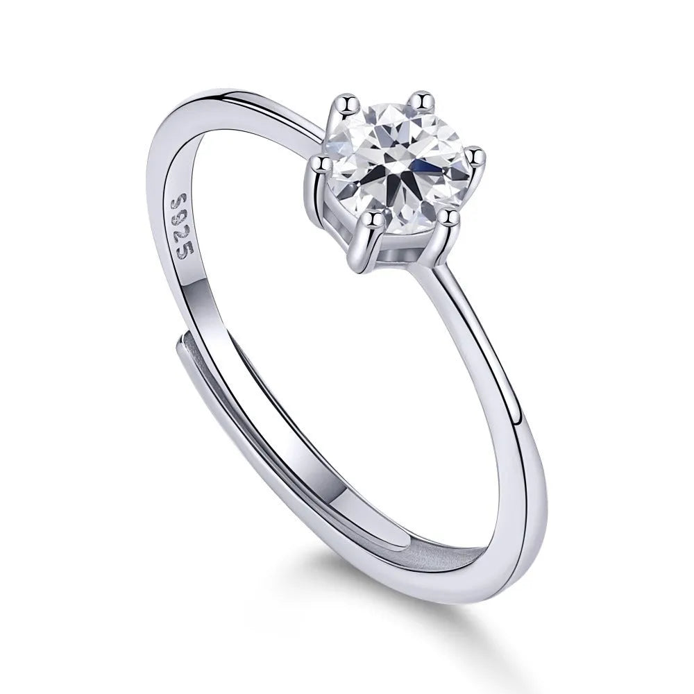 Sterling silver ring with six-claw zircon setting and open mouth adjustable band on white background