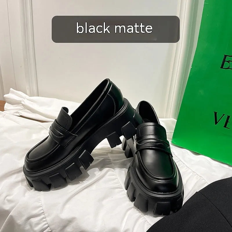 British style wide fit loafers in either matte or patent leather with distinctive muffin heel