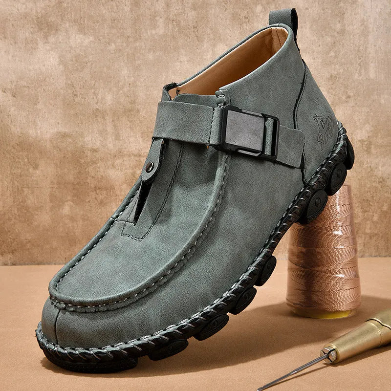 Casual flat heel slip-on shoe in synthetic leather with handmade stitching on the sole.