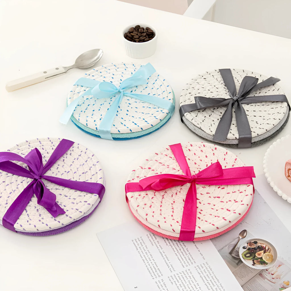 Three round cotton cord coasters in different colours showing 18cm diameter size