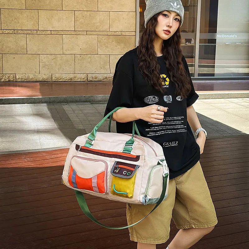 Large black oxford cloth sports messenger shoulder bag showing its spacious main compartment.