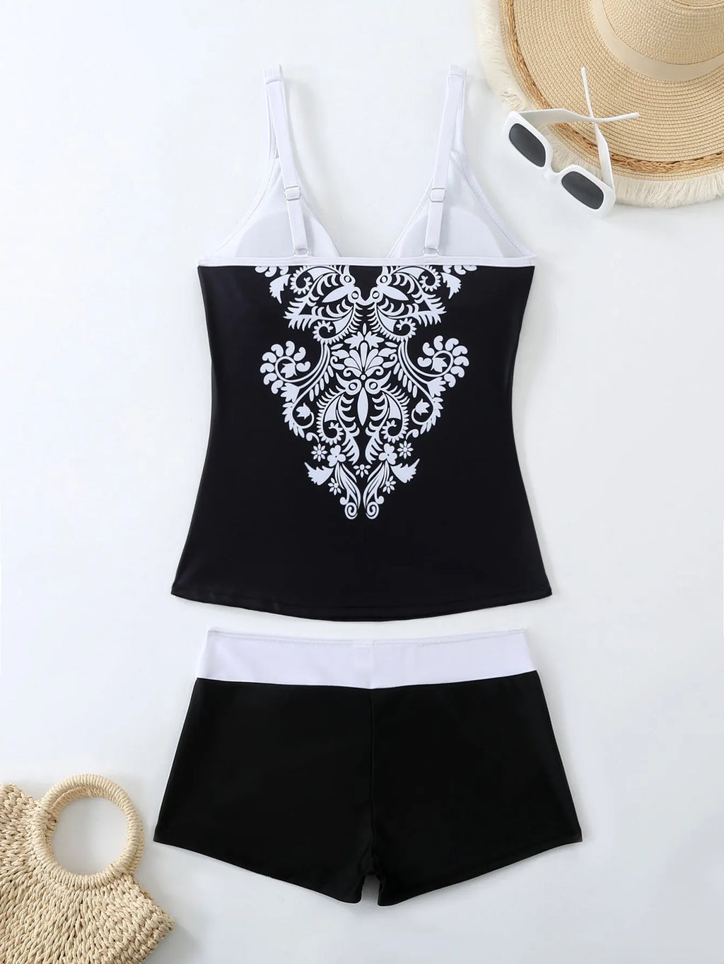 Women's plus size printed swimsuit in black or rose red, shown in briefs style.