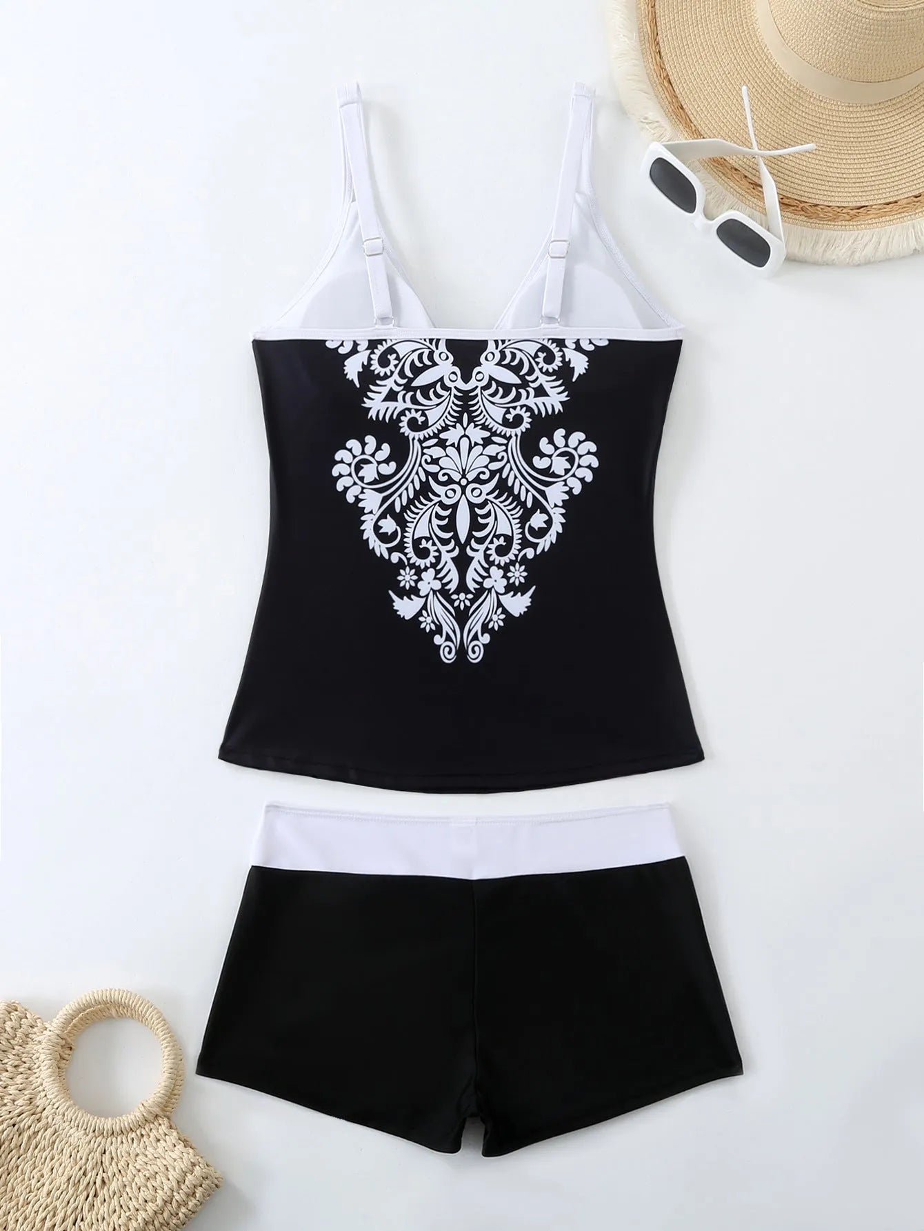 Women's plus size printed swimsuit in black or rose red, shown in briefs style.