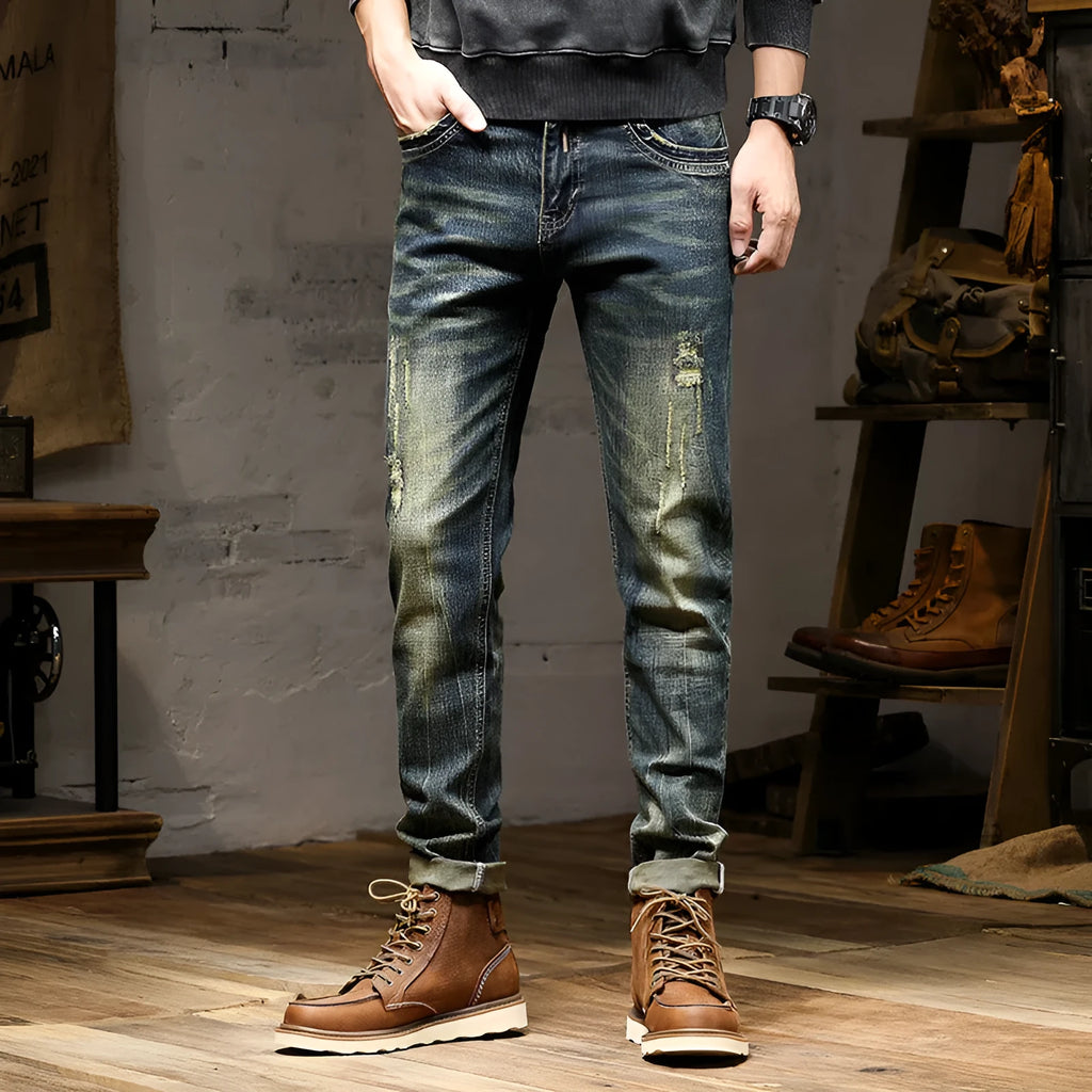 Men's skinny fit stretch jeans in a retro colour, showing zip fly and cotton denim fabric.