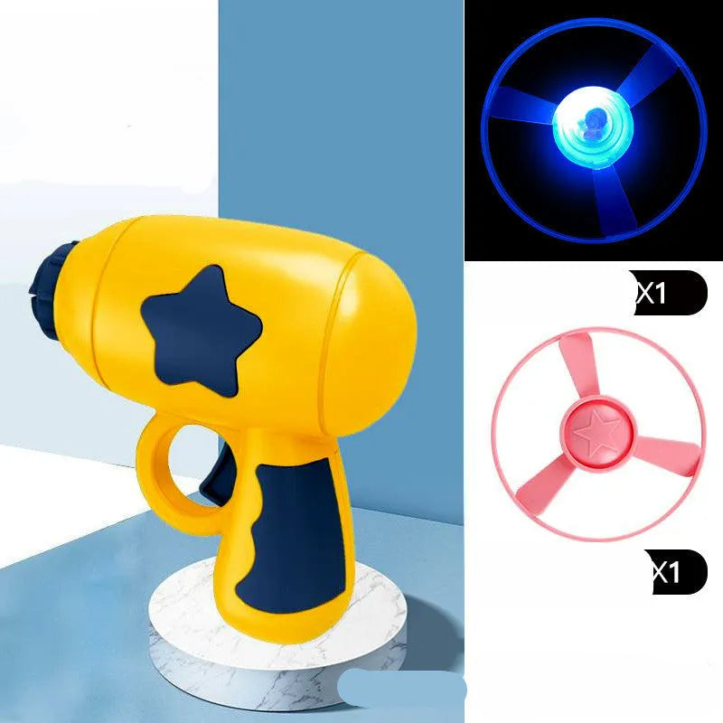 LED light-up flying saucer toy set with launcher gun, three glowing discs, and target board.