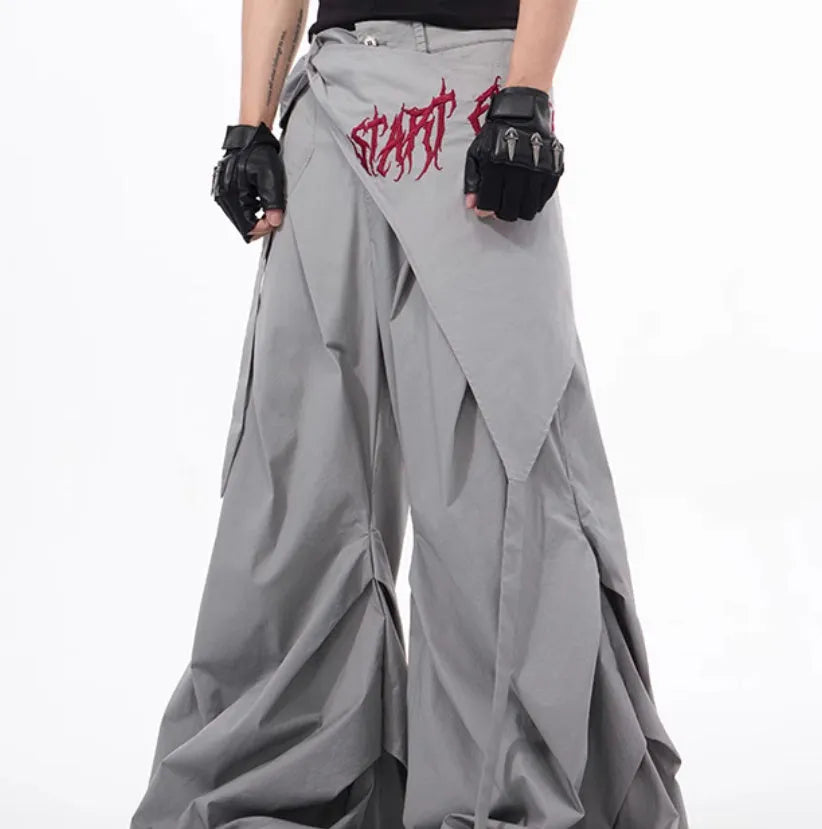 Boy modelling black wide-leg summer trousers with a relaxed fit and Korean-inspired style.