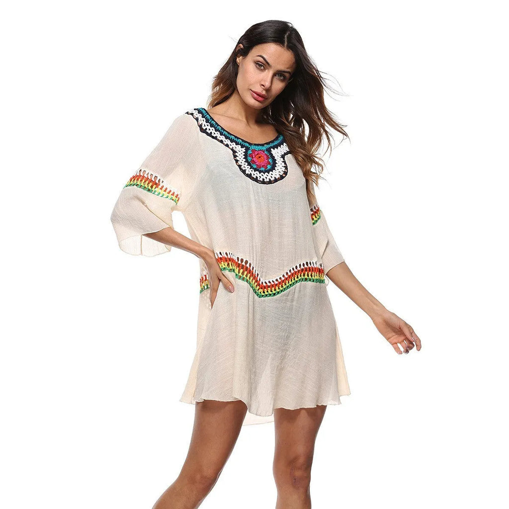 Women's crocheted ethnic style beach cover-up for sun protection, shown in apricot colour