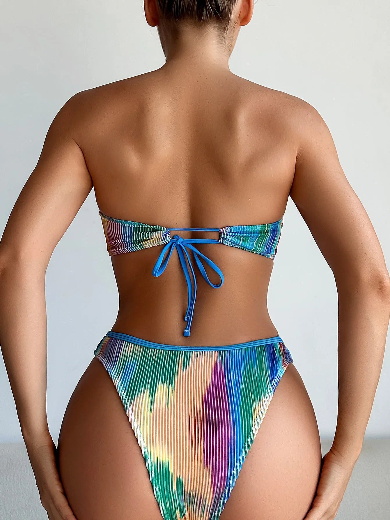 Colour printed women's tube top bikini set with briefs on a neutral background.