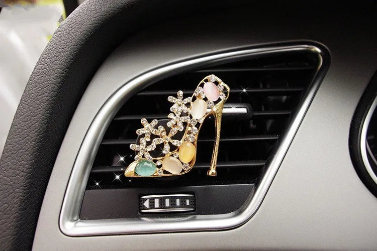 Alloy car perfume clip with liquid fruity scent attached to air vent in various cartoon styles