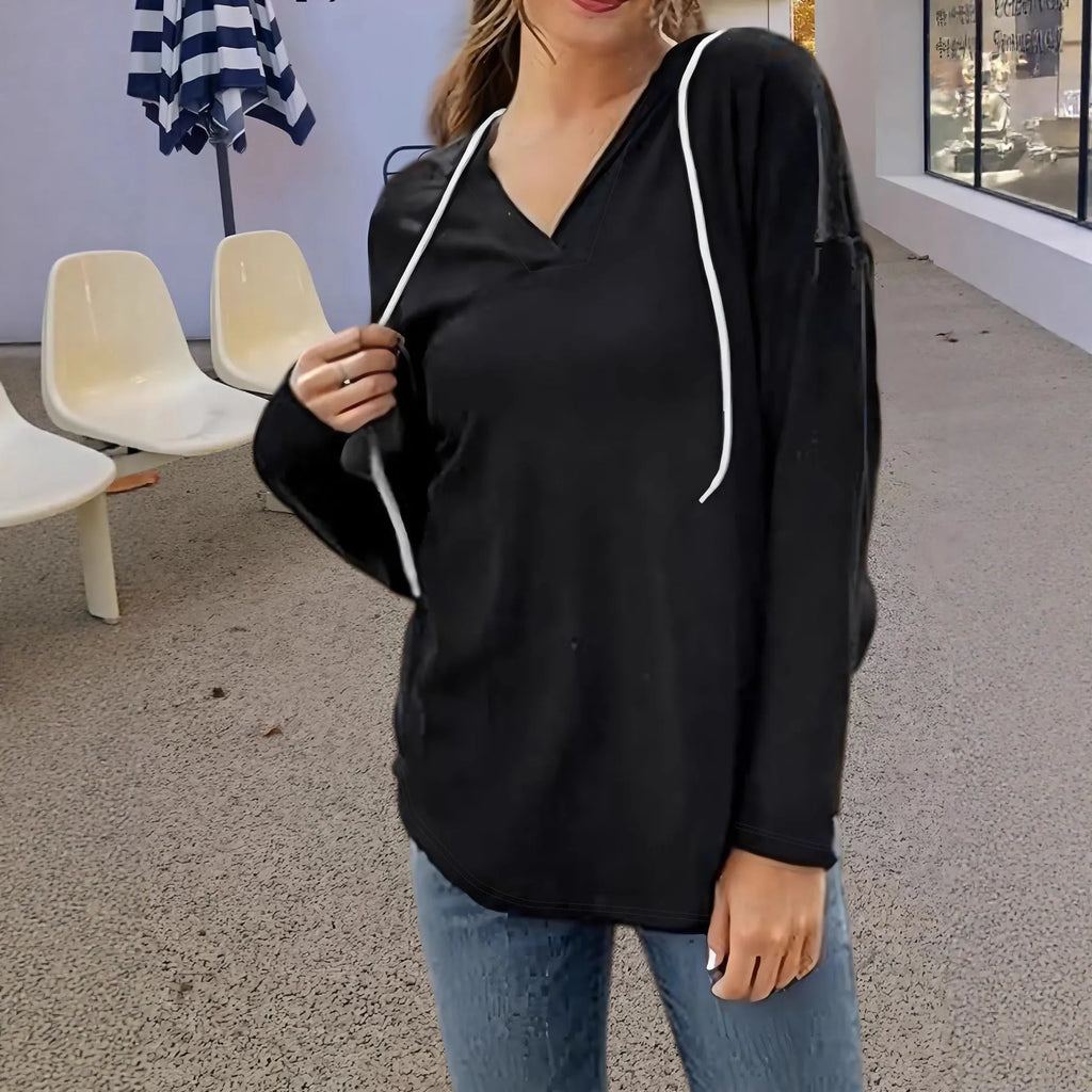 Red women's hooded V-neck sweatshirt with long sleeves on a hanger.