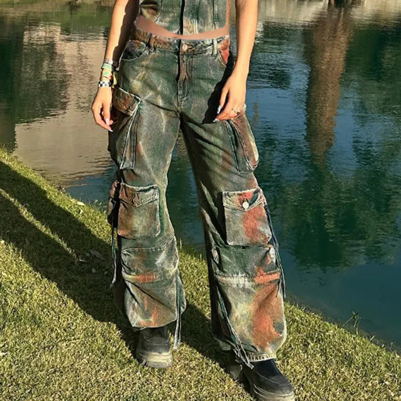 Loose blue denim cargo trousers with gradient colour pockets and a colour bloom wash