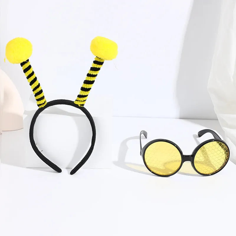 Yellow children's fancy dress set with bee motif headband and matching insect glasses.