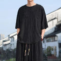Men's thin knit two-piece set showing short sleeve top and loose cropped trousers in grey.