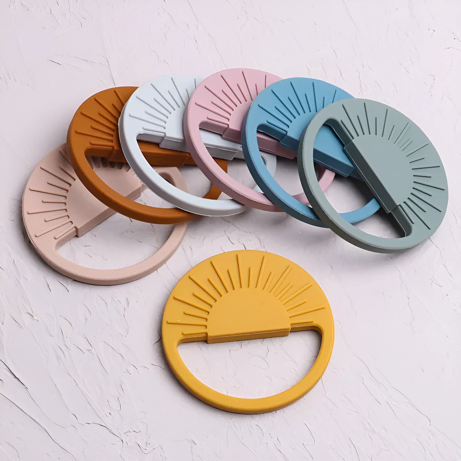 Silicone baby teether toy in multiple colours including pink and yellow, 88x88mm for infant teething relief