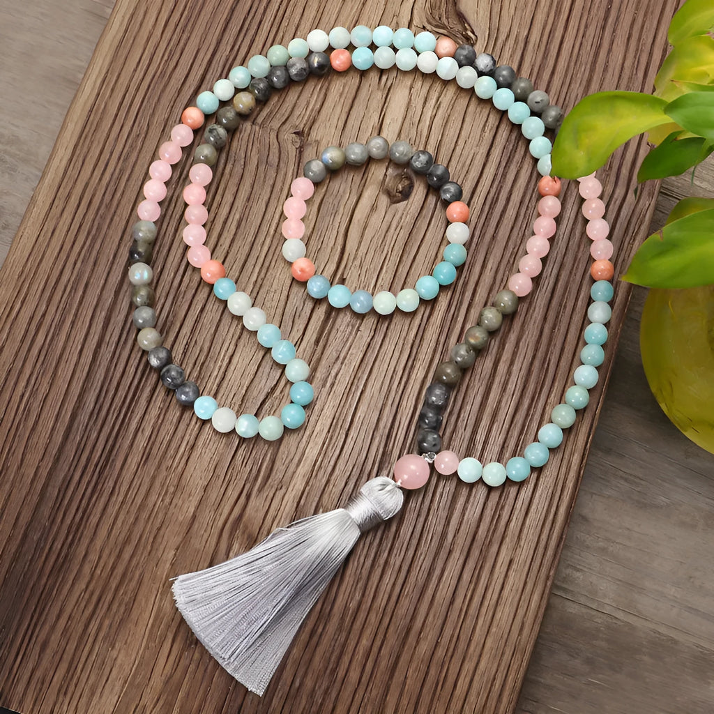 Bohemian 108 colourful stone necklace with drop-shaped tassel pendant on white background