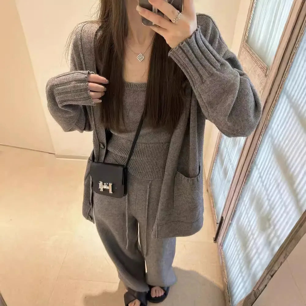 Women's light brown knit cardigan vest and suspender pants three-piece set laid flat