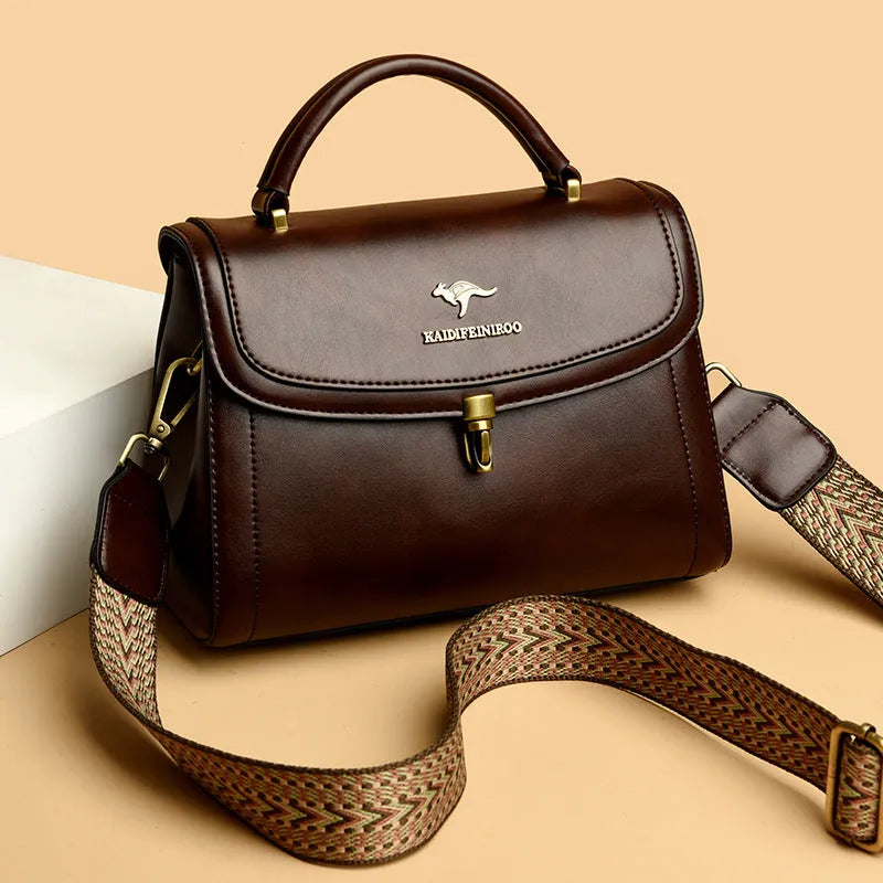 Women's textured PU crossbody handbag in black, 24x13x20cm, with sewing line detail and single shoulder strap