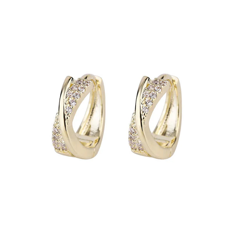 Geometric copper earrings with 14K yellow zircon stone accents showing simple wild aesthetic design