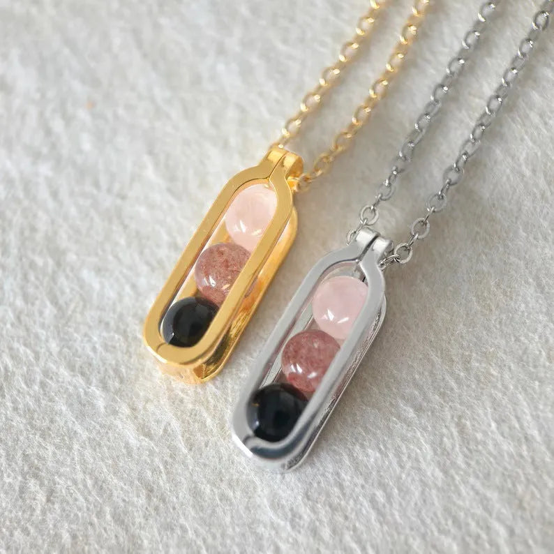 Minority simple pearl necklace in titanium steel with inlaid pearl, shown in gold or silver steel colour.