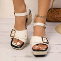 Women's black sandals with metal buckle fastening and chunky rubber sole, square toe design