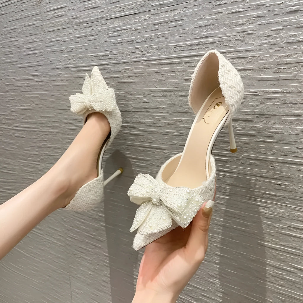 Women's pointed toe pumps with rhinestone bow, side cut-out and skirt detail, PU upper, beige