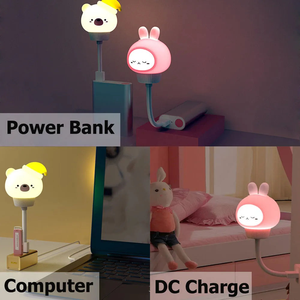 Cartoon animal USB portable LED night light with remote control on a bedside table.