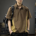 A brown men's loose-fit short-sleeve shirt with a half-zip front and stand collar.