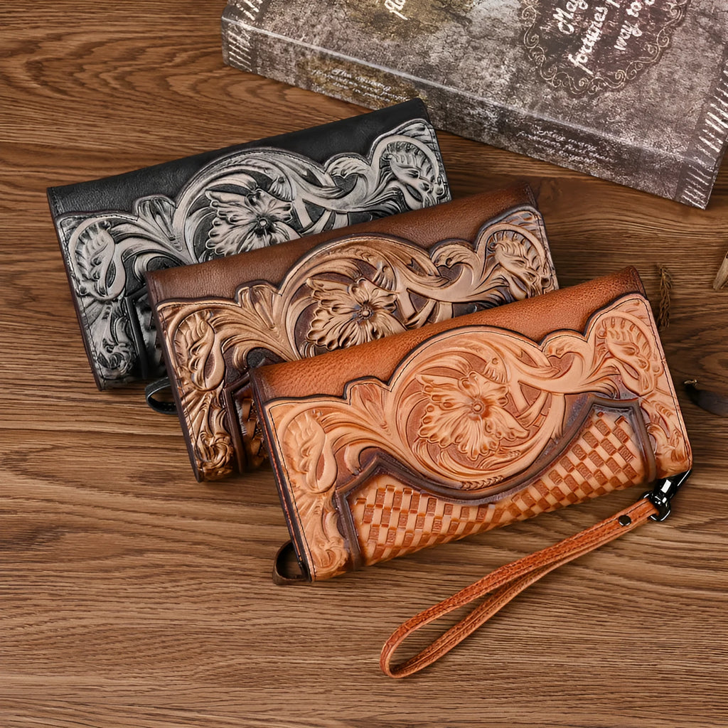 Women's embossed floral tri-fold leather wallet in retro brown colour showing cowhide texture and organisational compartments.