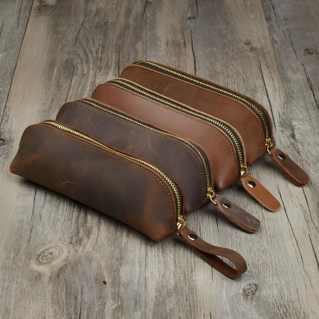 Black genuine leather pencil case with zipper closure measuring 18cm