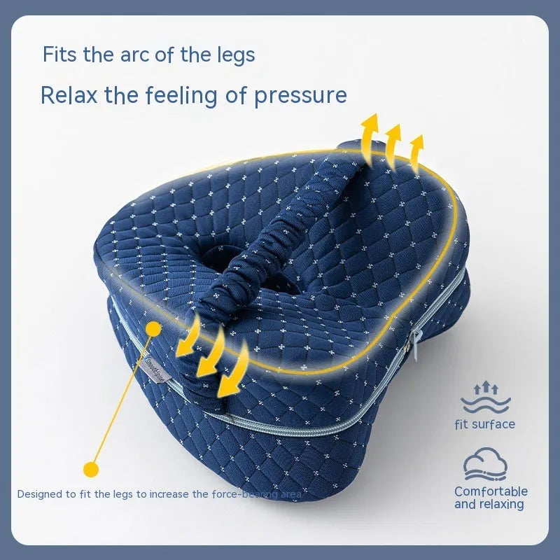 Dark blue jacquard heart-shaped memory foam leg pillow for adults showing its contoured design.