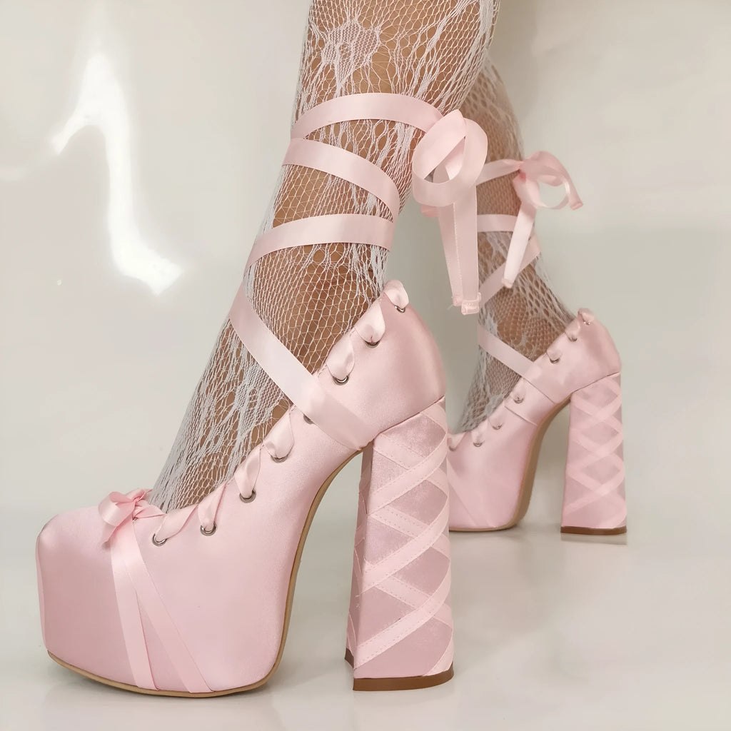 Pink chunky heel lace-up platform pumps with thick heel, round toe, and imitation leather upper