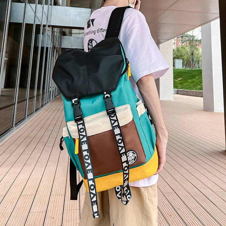 Oxford cloth backpack in black, green, or red with shoulder straps and handle