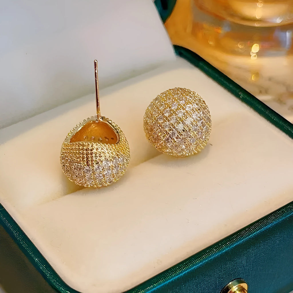 Women's gold and white drop-shaped ear clip earrings with full diamond embellishment and geometric golden beans design