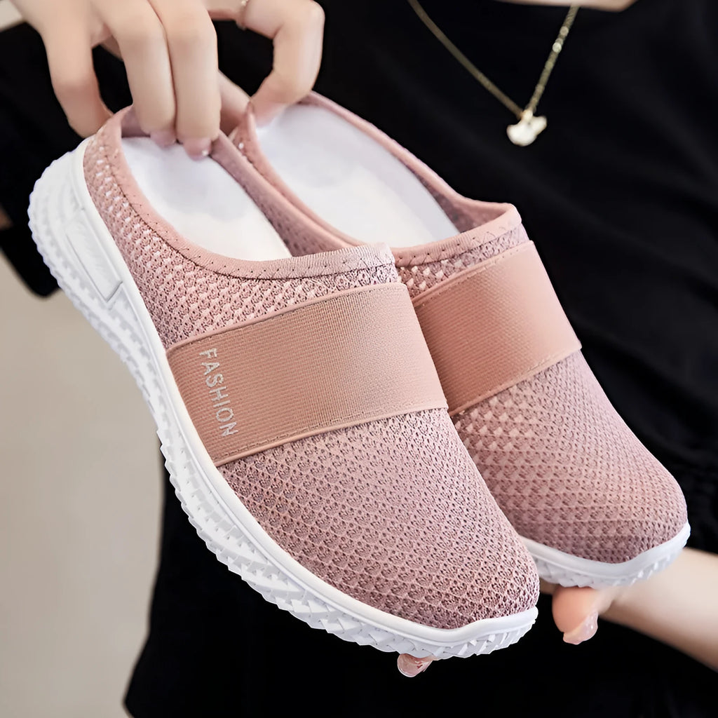 Women's black mesh casual flat shoes with hollow out design and round toe.