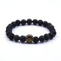 Natural stone dog paw bracelet with tiger eye beads and gold finish on a neutral background