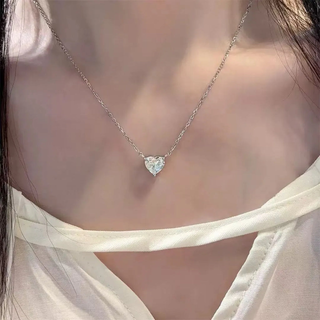 Women's silver love necklace with heart pendant on copper chain