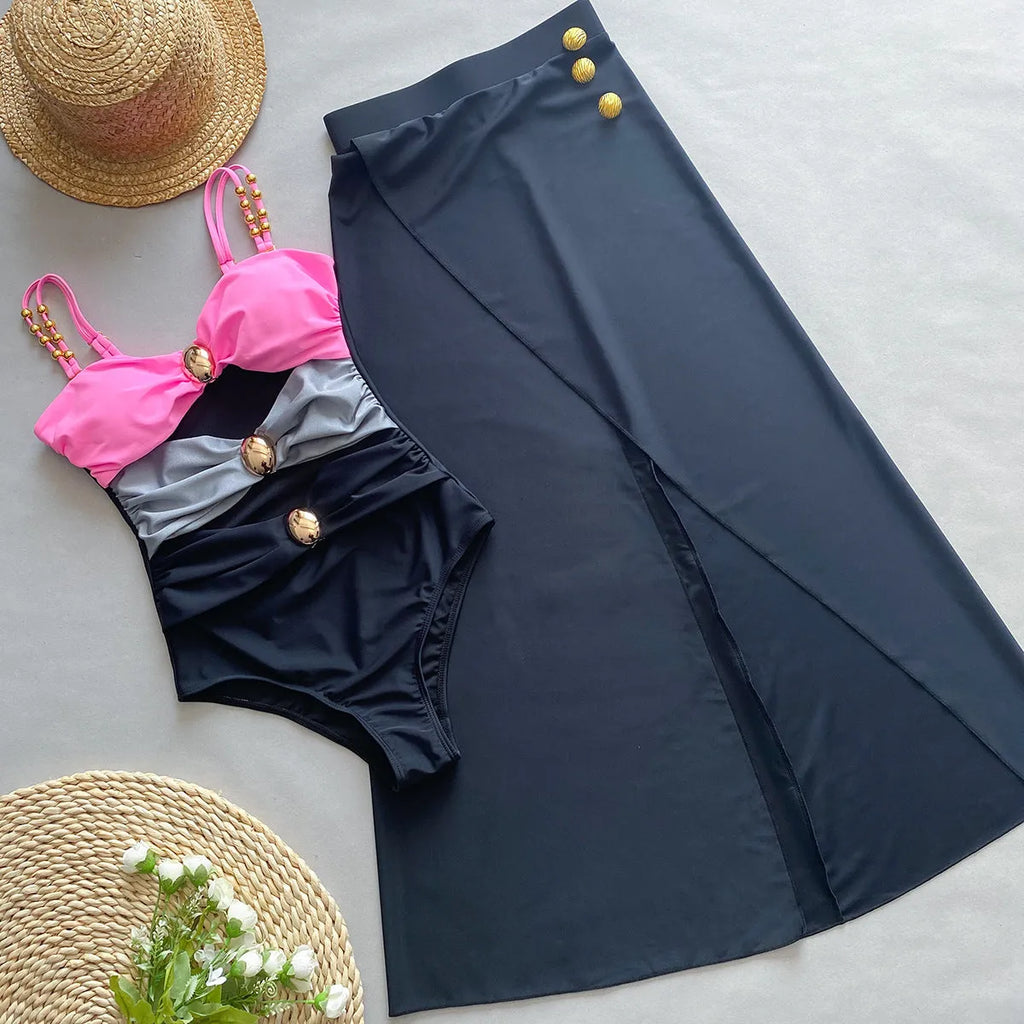 Women's brown one-piece swimsuit with a matching detachable beige skirt laid flat.