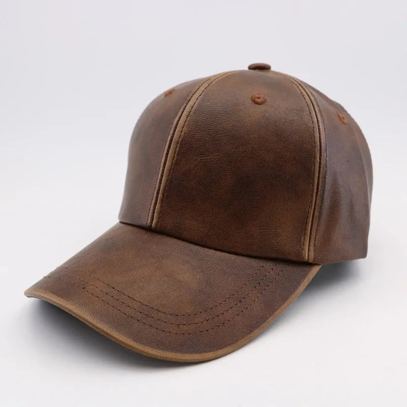 Washed and worn PU baseball cap with hard top peak, adjustable dome crown, brown colour, street travel fashion