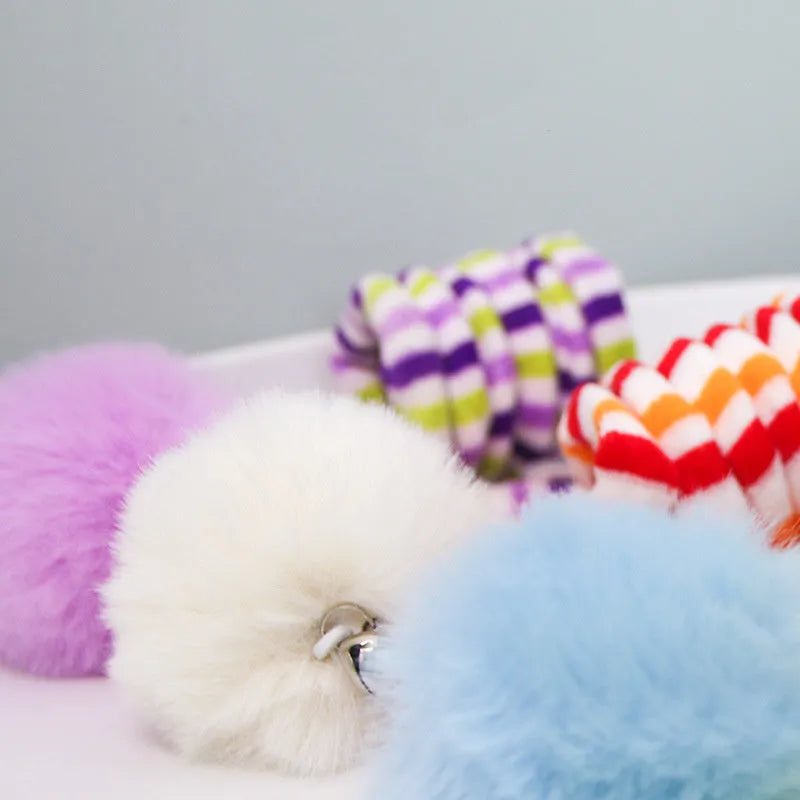Hanging suction cup cat toy with colourful spring, inflatable ball, and bell for indoor cats