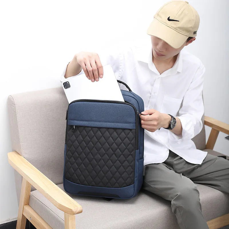 Men's Oxford cloth travel backpack in black with curved shoulder straps and diamond mesh panels