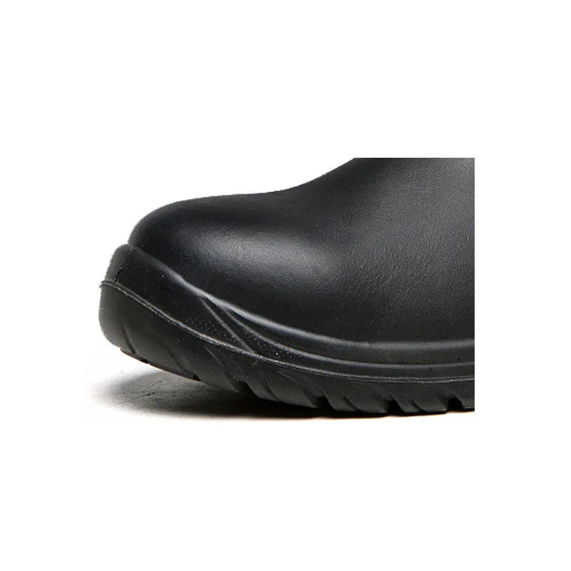Black high-top leather safety work boots with anti-piercing feature on a work site background.