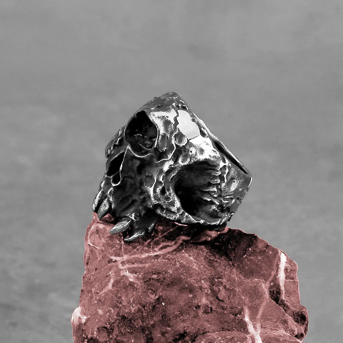 Alloy ring with electroplated finish showing one-eyed skull design in retro punk style