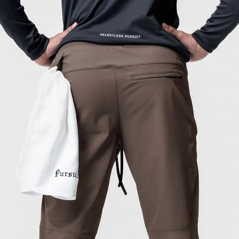 Men's grey quick-dry fitness trousers with ankle-tied design for gym workouts