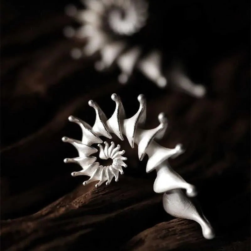 Three-dimensional matte finish conch shell stud earrings with irregular geometric design