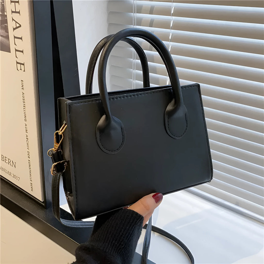 PU synthetic leather small horizontal square shoulder bag in five colour options showing document pocket and single strap