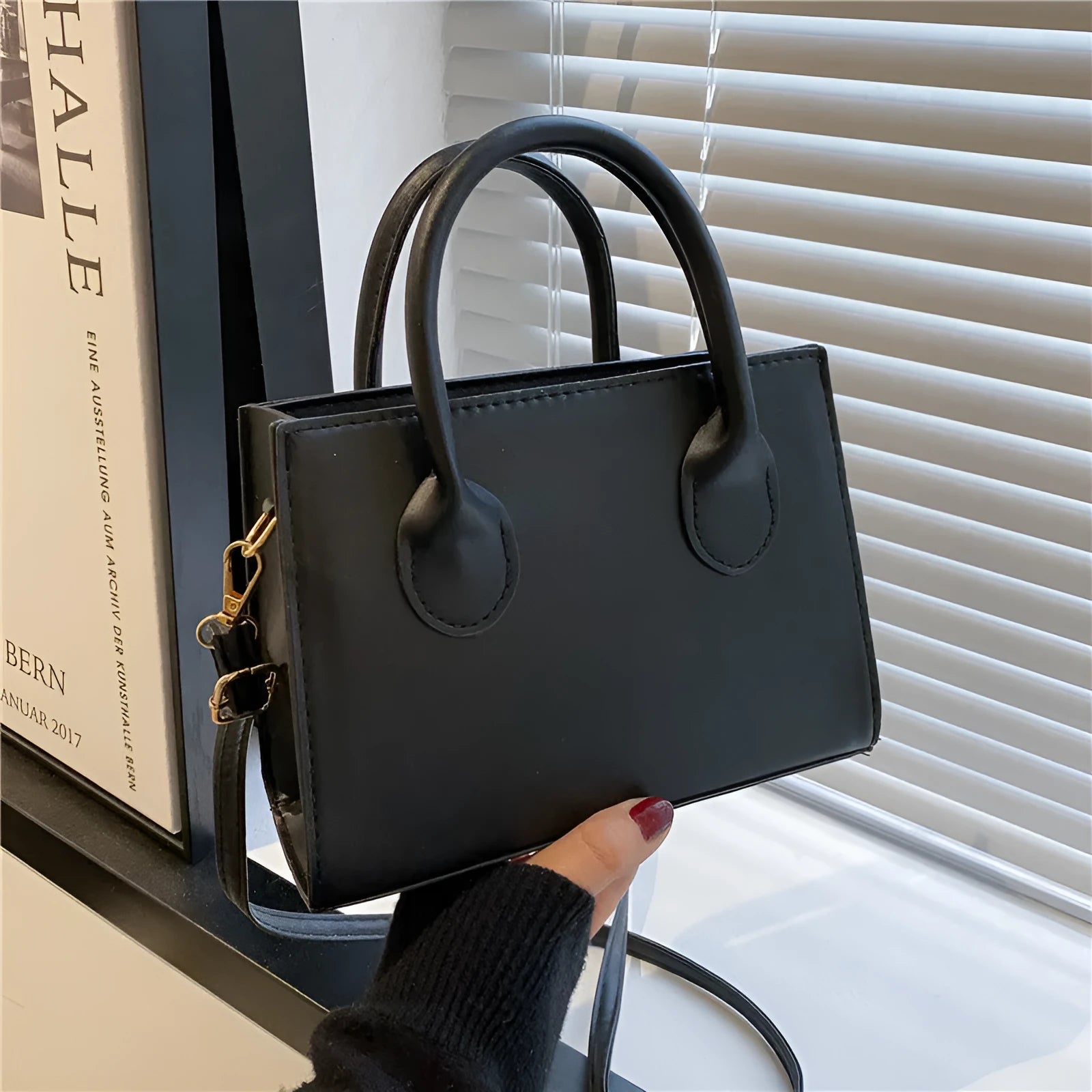PU synthetic leather small horizontal square shoulder bag in five colour options showing document pocket and single strap