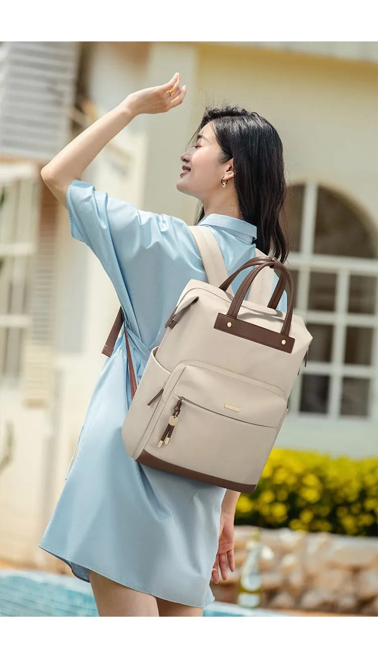 Women's large synthetic leather backpack in apricot colour with adjustable shoulder strap.
