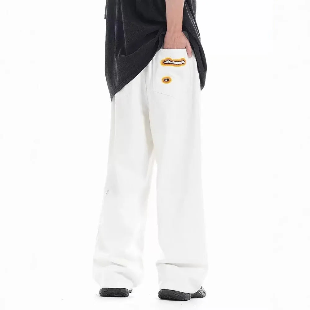 Retro washed ripped embroidery loose straight-leg trousers in white with zipper fly